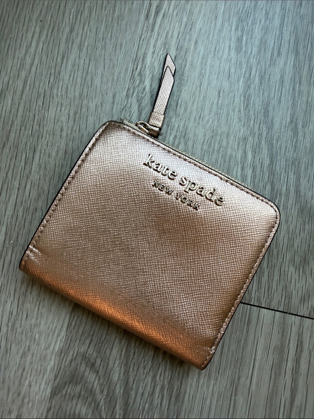 kate spade metallic rose gold zip-around wallet
